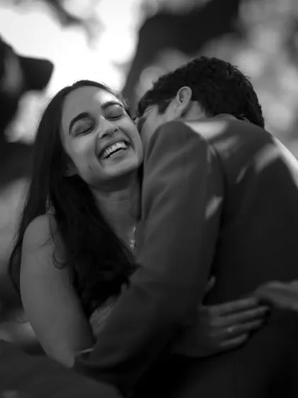 I believe the most beautiful moments are the unscripted ones. This candid, black and white portrait focuses on pure, unrestrained laughter, capturing the genuine joy and comfort you find in each other's arms.