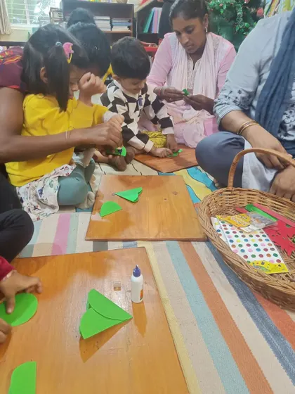 A close-up of the Christmas tree craft in progress. We provide all the materials needed for children to bring their creations to life.