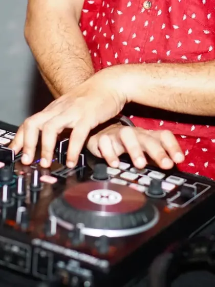 Music is the moonlight in the gloomy night of life. A close-up on my hands at work, tweaking the knobs and faders to create the perfect sound.