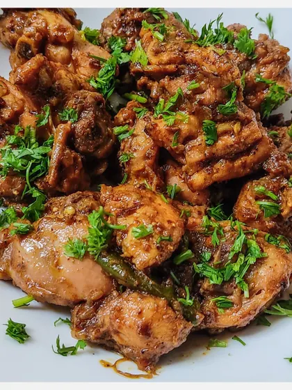 This is my signature Karnivore Chicken Fry, an Old Bangalore Naati style dish. I use meaty chunks of chicken, a homemade masala, and cook it until it's juicy, succulent, and finger-licking good.