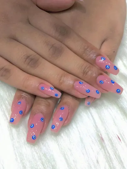 A still shot of the popular evil eye nail art.