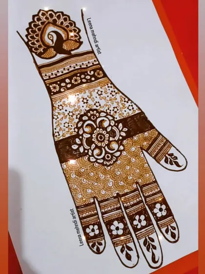 A beautiful example of a band-style bridal design, combining different patterns like florals, paisleys, and a peacock cuff. This is a great way to learn how to structure a complex piece.