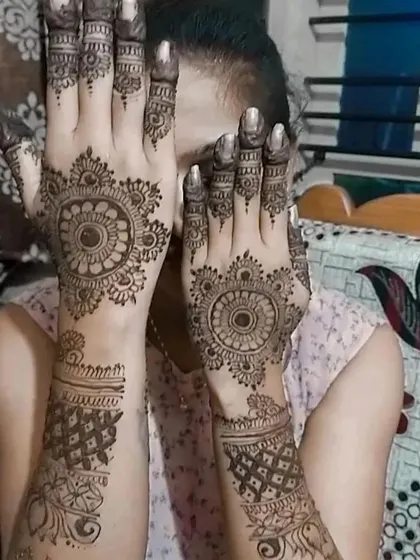 Another pose showing the beautiful back-hand mandala mehendi.