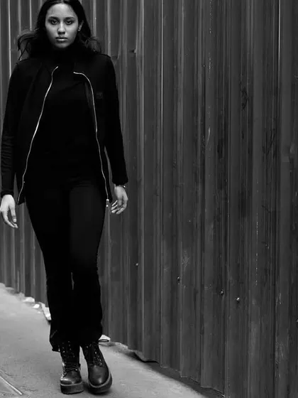 Capturing a moment of movement on a city street. This candid-style shot adds a sense of real-life energy to a model's portfolio.