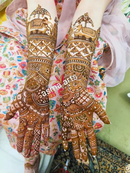 The baraat procession comes to life in this design, with elephants carrying the groom on the forearms. The rest of the design is filled with intricate jaali (net) patterns and floral work for a complete bridal look.