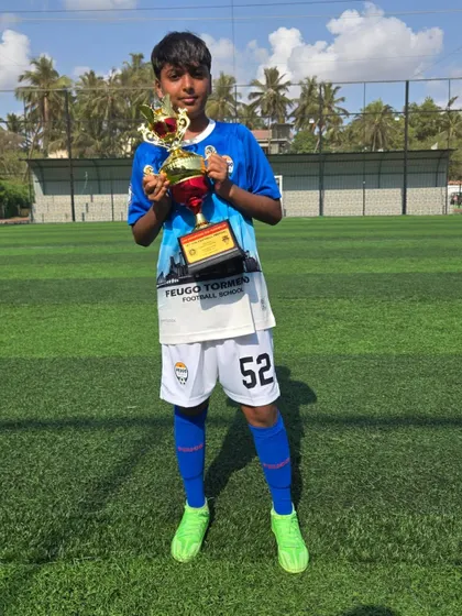 A player from our U14 Feugo Lions team with his trophy.
