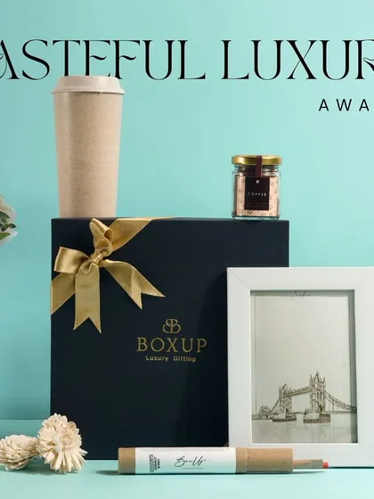 Tasteful luxury awaits. This hamper combines a reusable coffee cup, a photo frame, and other simple yet elegant items, showing how you can create a sophisticated gift.
