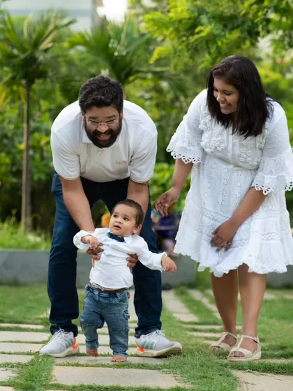 Capturing those first wobbly steps is a precious milestone. I love being there for these big moments during an outdoor family shoot, with mom and dad cheering on.