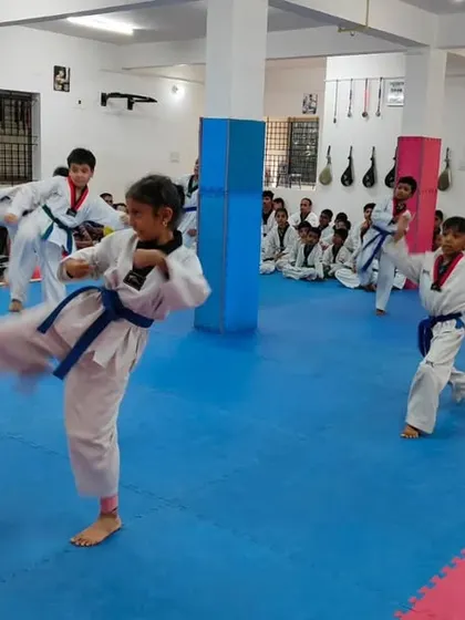 A student executes a high kick.