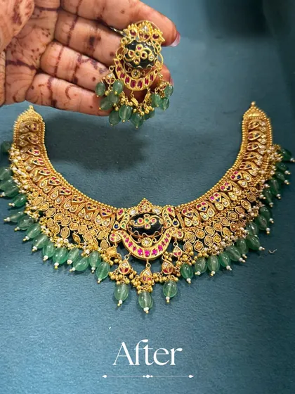 The 'After' shot of a beautiful transformation. This heavy gold necklace was given a fresh look with deep green emerald beads and intricate enamel work, turning it into a regal piece.