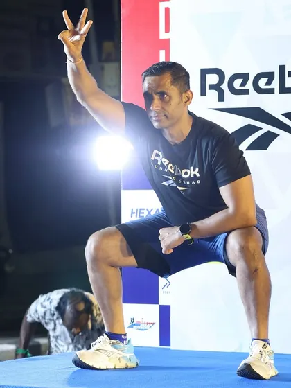 Holding a squat position while instructing the crowd. Leading by example is a core part of my coaching philosophy.