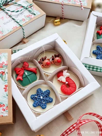 A snippet of my 'Merry Christmas' tealight gift sets. This box of four includes a gift, reindeer, snowflake, and candy cane design.