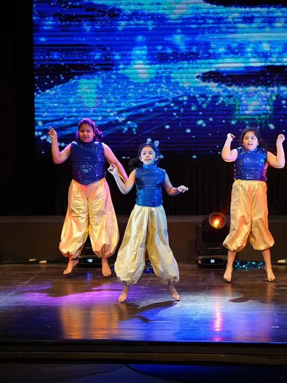 Our Bollywood kids' group in a joyful, high-energy moment of their routine. Their smiles say it all!