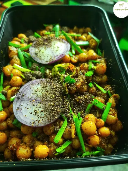 'Kelichana' garnished with ground perilla seeds, which adds a nutty and earthy flavor to the spicy chickpeas.