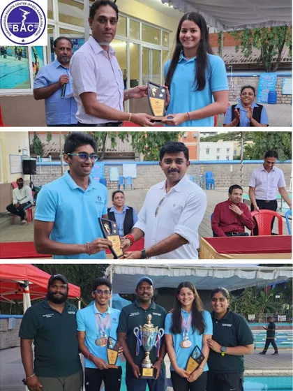 Individual champions Shirin and Aneesh with their trophies and coaches.