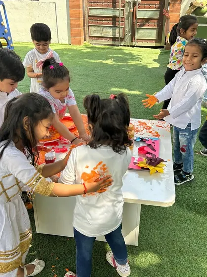 Friends celebrating Holi together in the true spirit of the festival. We ensure our celebrations are inclusive, safe, and full of joyful interaction.
