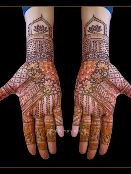 A classic Indian mehendi design that's perfect for wedding guests. The pattern is detailed but doesn't provide full coverage, making it elegant and comfortable to wear.