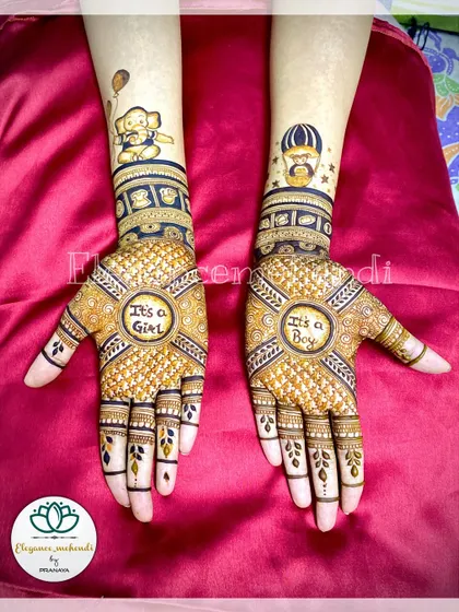 This gender reveal mehendi was so much fun to create. The design features "It's a Girl" and "It's a Boy" in the palms, surrounded by cute elephant and portrait motifs.