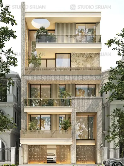 This facade for a 247 sq. yard plot in Prashant Vihar, New Delhi, uses natural stone textures and a circular cutout on the terrace level to create a unique and organic feel.