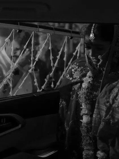 The Vidaai, one of the most emotional moments of a wedding. This black and white shot captures the bride in the car, a quiet and poignant frame that speaks of goodbyes and new beginnings.