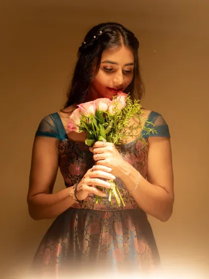 The beautiful details of the gown's fabric and the client's serene expression make this a favorite shot.