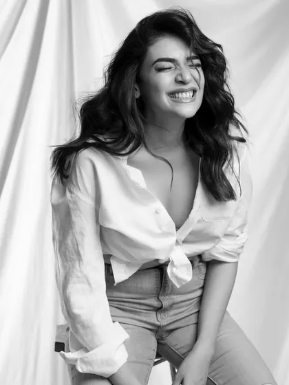 The joy on a client's face says it all. Here, I created a textured cut with face-framing layers, styled into effortless beach waves. This look is all about creating natural volume and a relaxed, happy vibe.