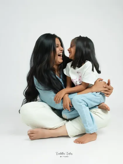 A moment of shared laughter between a mother and her daughter. My studio sessions are designed to capture this genuine connection, creating portraits that radiate love and happiness.