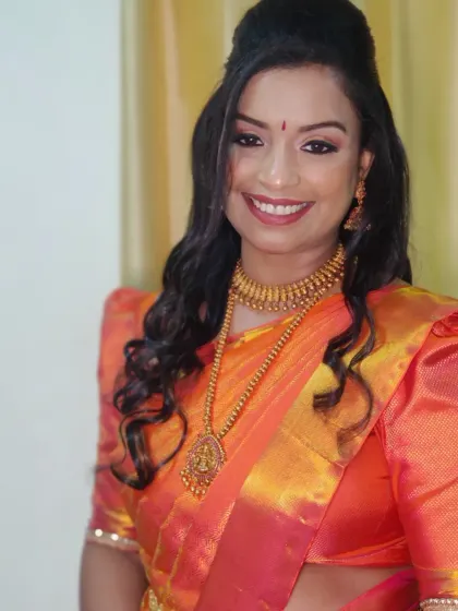 The complete look, showcasing the expertly pre-pleated saree and complementary makeup.