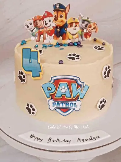 This Paw Patrol cake was made for Agastya's 4th birthday. It features the whole team of pups, the Paw Patrol logo, and cute paw prints around the side for a fun and adventurous theme.