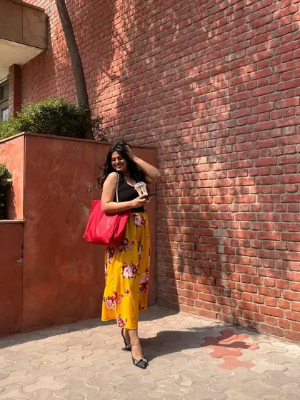 I added a bright red tote bag to this look, showing how a pop of contrasting color can add an extra bit of fun and personality to your outfit.