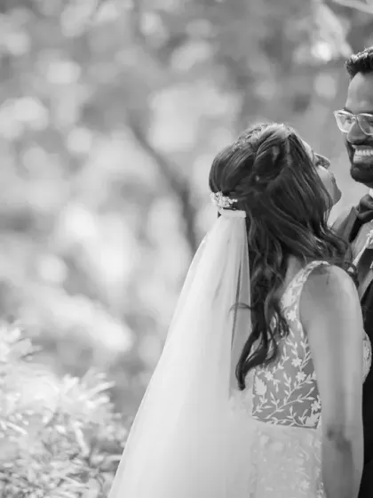A beautiful black and white candid of the couple sharing a laugh. These are the moments that truly capture the joy of a wedding day.