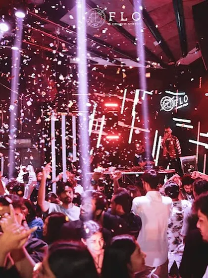 Beams of light and confetti create a magical moment at Flo Church Street. It's a full audio-visual experience.