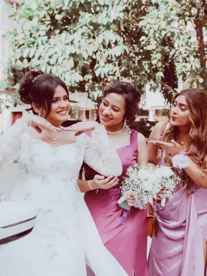 Fun with the bridesmaids. This candid shot captures the joy and friendship of the bridal party.