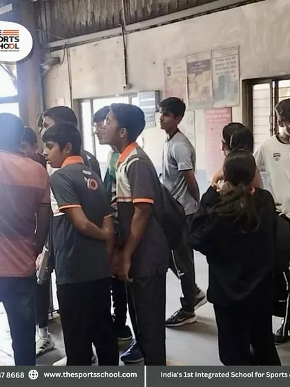 Students listen attentively as a factory guide explains the different stages of production.