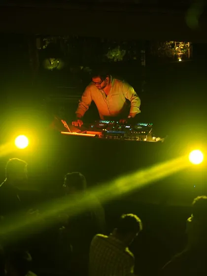 Another photo from the same series, with bright yellow lights creating a powerful visual.