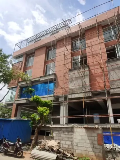 The building under scaffolding during the construction process.