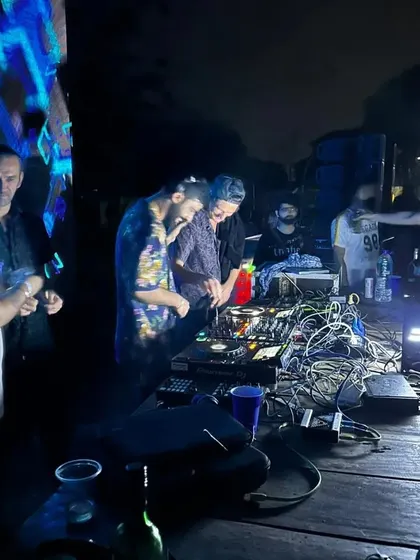Another shot from the Vortex party, with the complex wiring of the DJ setup showing the technical side of the craft.