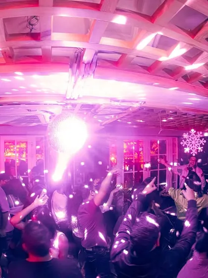 The party in full swing under the iconic disco ball at Monkey Bar.