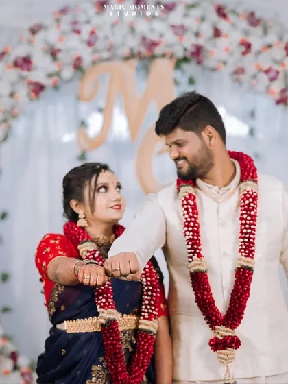 A fun fist bump after the ring exchange. This playful gesture shows the couple's personality and friendship.