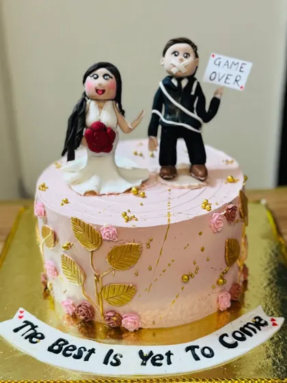 A humorous "Game Over" cake for a bride and groom to-be.