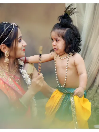 A playful 'Makhan Chor' moment between mother and son. We create fun, story-based scenes to bring your photoshoot theme to life.