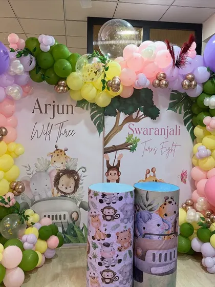 Another view of the joint birthday setup, showing the custom-printed plinths and character cutouts that add detail and fun.