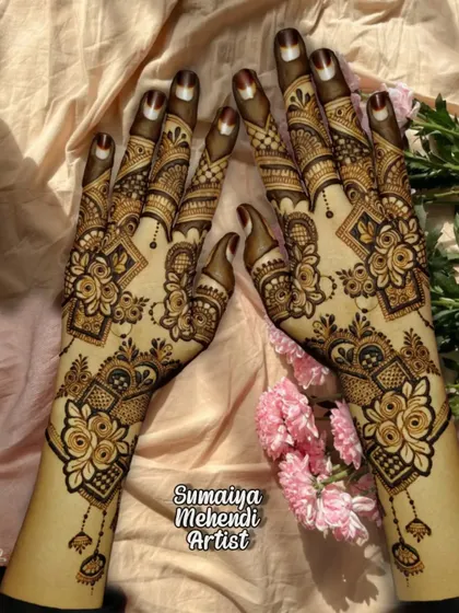 A beautiful party henna design with a mix of roses and geometric shapes, perfect for any celebration.