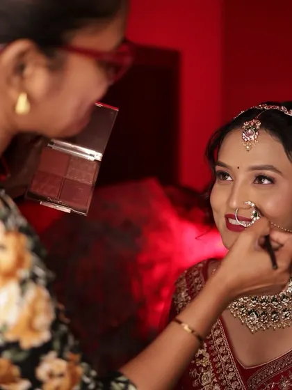 A beautiful interaction between me and the bride, ensuring she is comfortable and happy with her look.