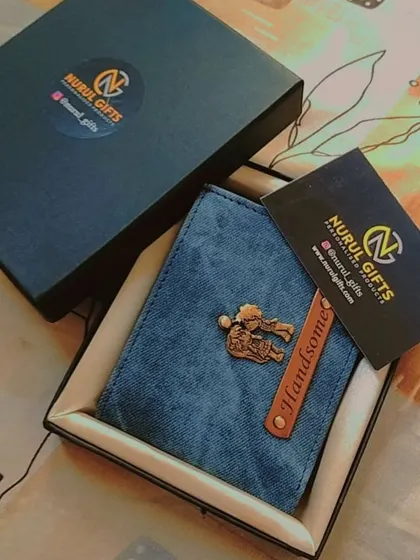 This personalized denim wallet with a 'Handsome' tag and a gym-themed charm is shown with its branded packaging, making it a complete gift.