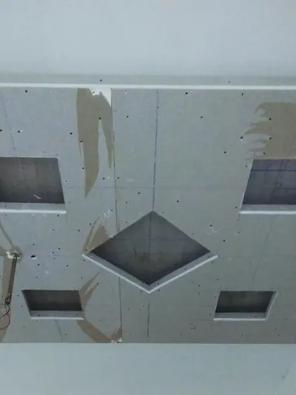 An in-progress ceiling with square and diamond-shaped cutouts. These will later become features for recessed lighting or decorative panels.