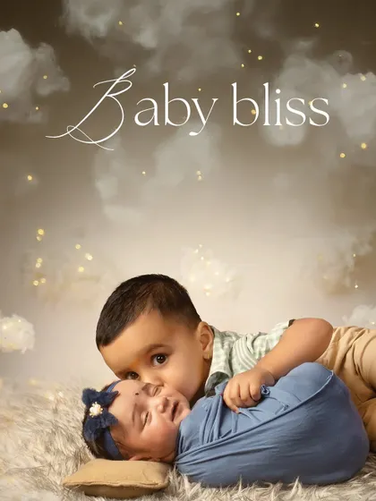Baby bliss and sibling love. This tender moment between a big brother and his newborn sister is a precious memory, beautifully captured on a soft, dreamy cloud backdrop.