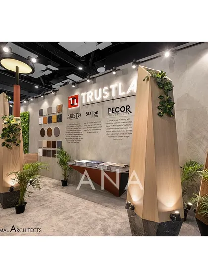 A close-up of the sculptural 'flame' pillars at the Trustlam '23 booth. Clad in the brand's laminate and uplit for dramatic effect, these structures beautifully showcased the product while reinforcing the core design concept.
