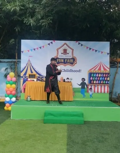 A moment of interaction with the audience during my carnival show. I always keep the energy high and ensure everyone feels like they are part of the magic.