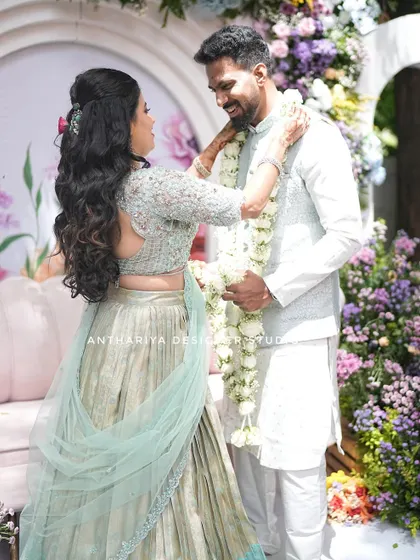 A playful moment during the garland ceremony.